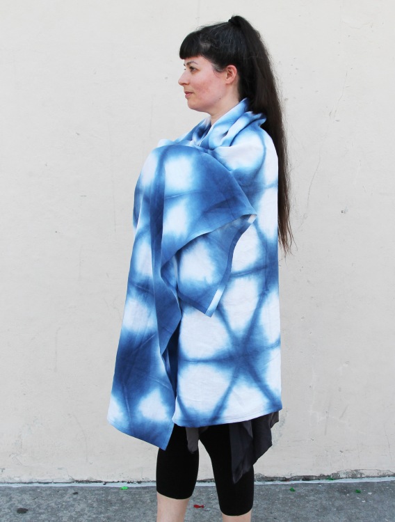 woman wearing large blue and white shibori dyed linen shawl